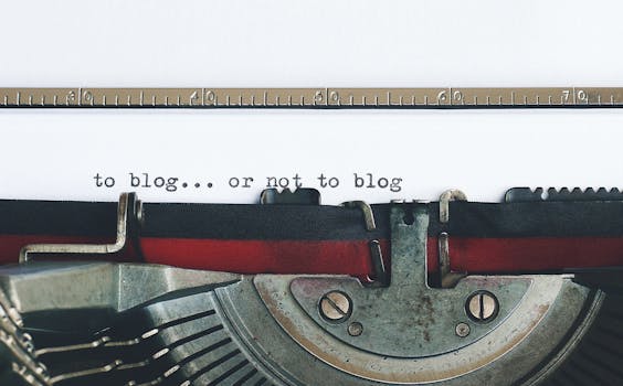 Classic typewriter with 'to blog or not to blog' typed on paper.